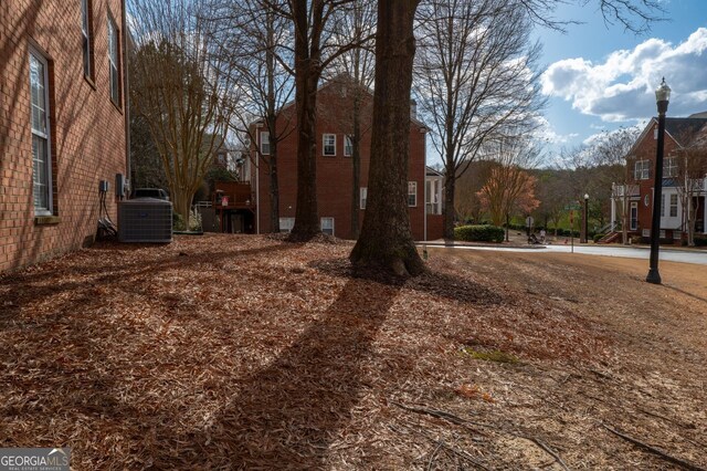 view of yard with cooling unit and a residential view