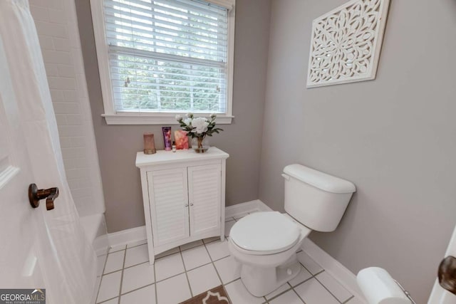 bathroom featuring baseboards, toilet, shower / bath combination with curtain, and tile patterned flooring