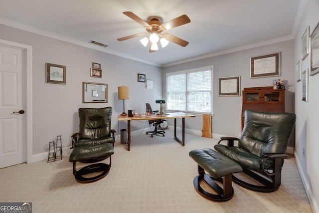 carpeted office space with visible vents, baseboards, ornamental molding, and a ceiling fan