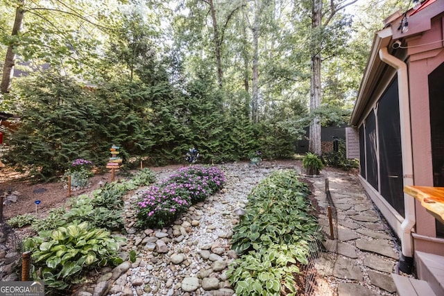 view of yard featuring a sunroom