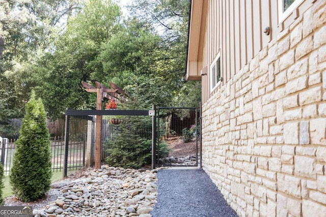 view of gate featuring fence