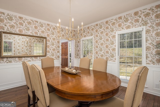 dining room featuring wallpapered walls, an inviting chandelier, dark wood-style flooring, wainscoting, and crown molding