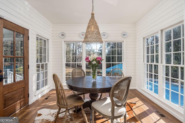 sunroom featuring visible vents
