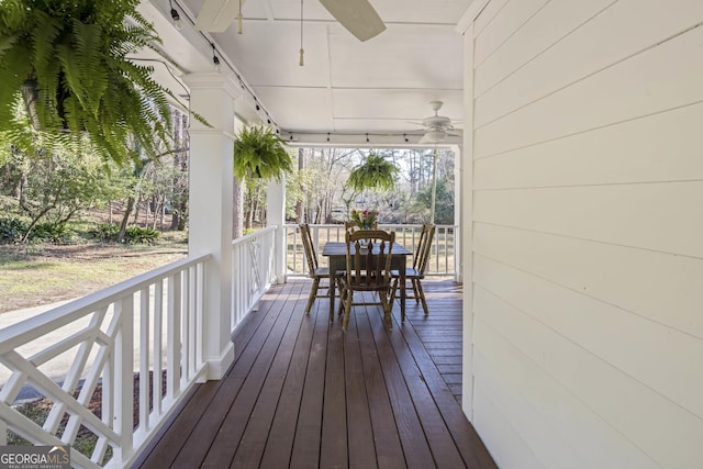 wooden terrace featuring ceiling fan