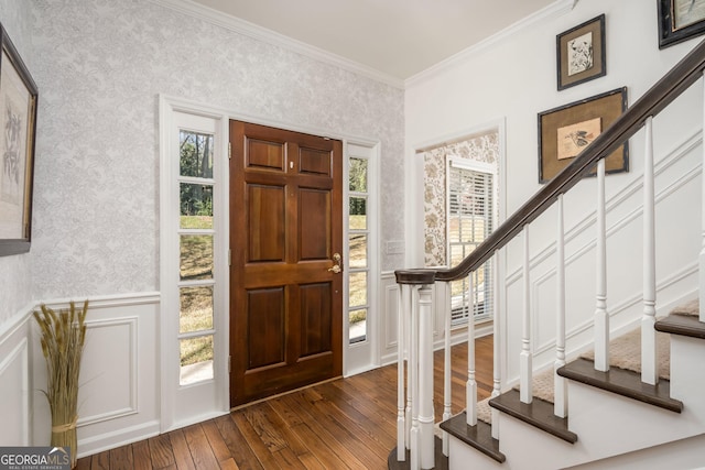 entrance foyer with stairway, wainscoting, wallpapered walls, and ornamental molding