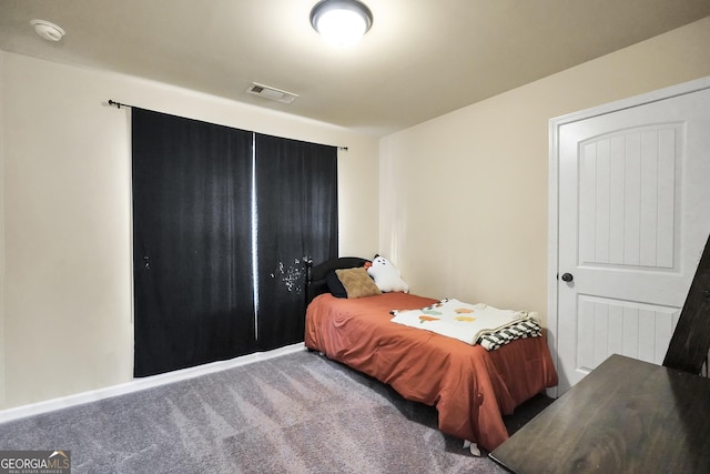 bedroom with visible vents and carpet floors