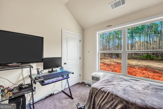 carpeted bedroom with vaulted ceiling and visible vents