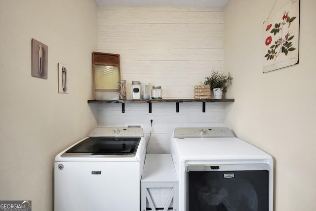 laundry area with laundry area and washer and clothes dryer