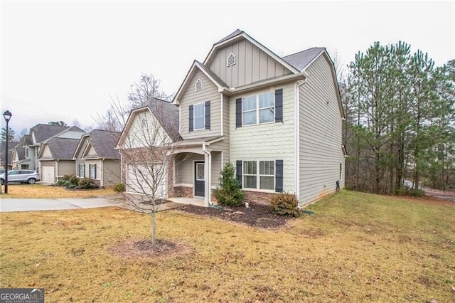 view of front of house featuring concrete driveway, an attached garage, board and batten siding, and a front lawn