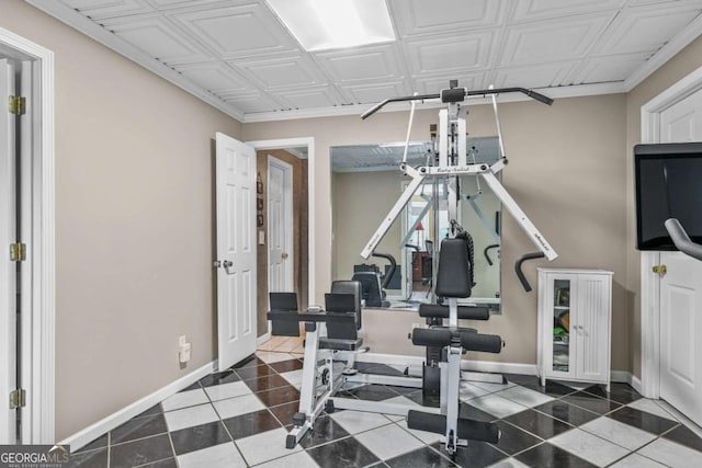 workout area with tile patterned flooring, baseboards, and an ornate ceiling