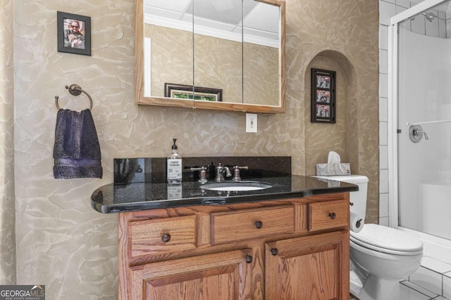 bathroom with an enclosed shower, toilet, ornamental molding, and vanity