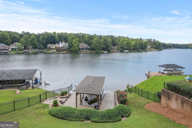 exterior space with a gazebo, a lawn, a water view, and boat lift