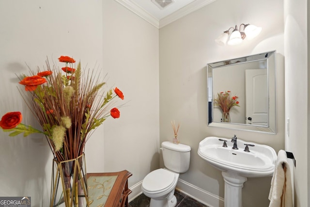 bathroom featuring tile patterned flooring, visible vents, baseboards, toilet, and ornamental molding