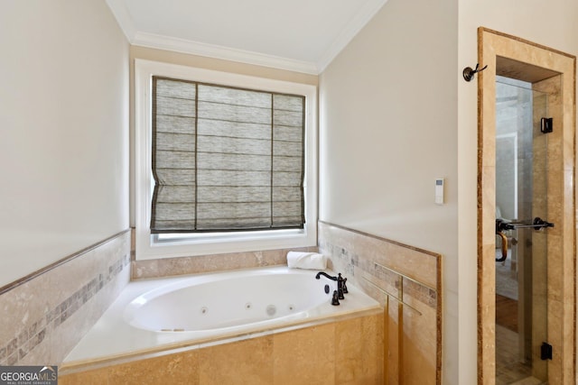 bathroom featuring a stall shower, ornamental molding, and a whirlpool tub