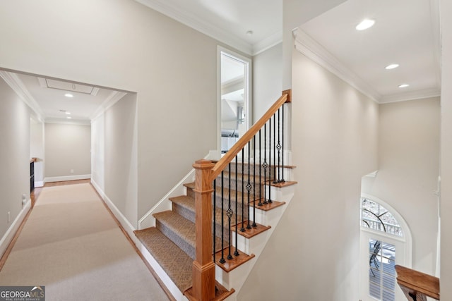 stairway featuring recessed lighting, baseboards, attic access, and ornamental molding