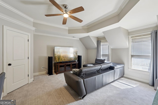 living room featuring a ceiling fan, light colored carpet, and a healthy amount of sunlight