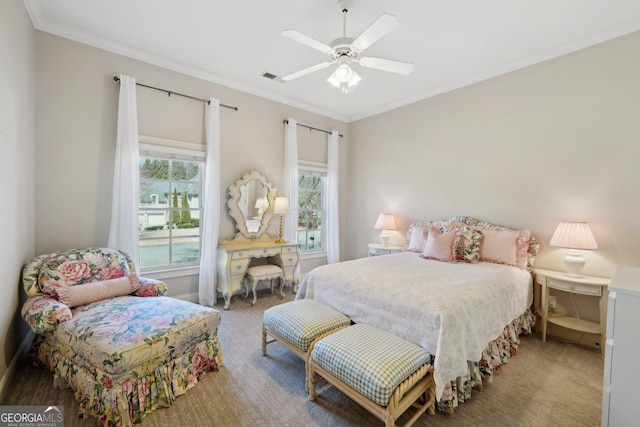 bedroom featuring visible vents, carpet, crown molding, and a ceiling fan