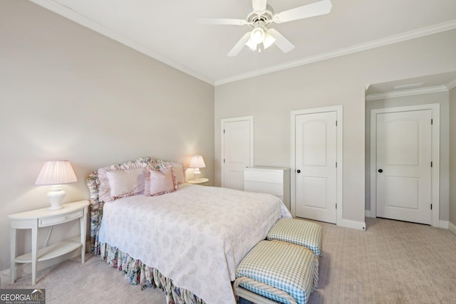 bedroom featuring crown molding, carpet flooring, a ceiling fan, and baseboards