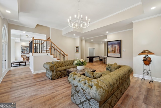 living area with stairs, baseboards, light wood-type flooring, and a chandelier