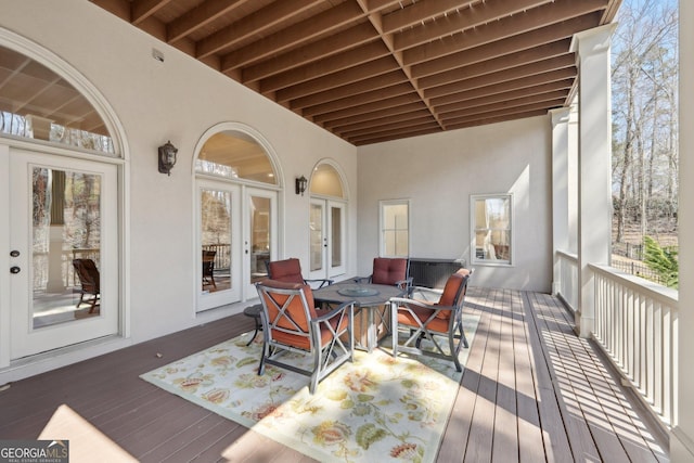 wooden deck featuring french doors