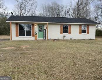 ranch-style house with a front yard