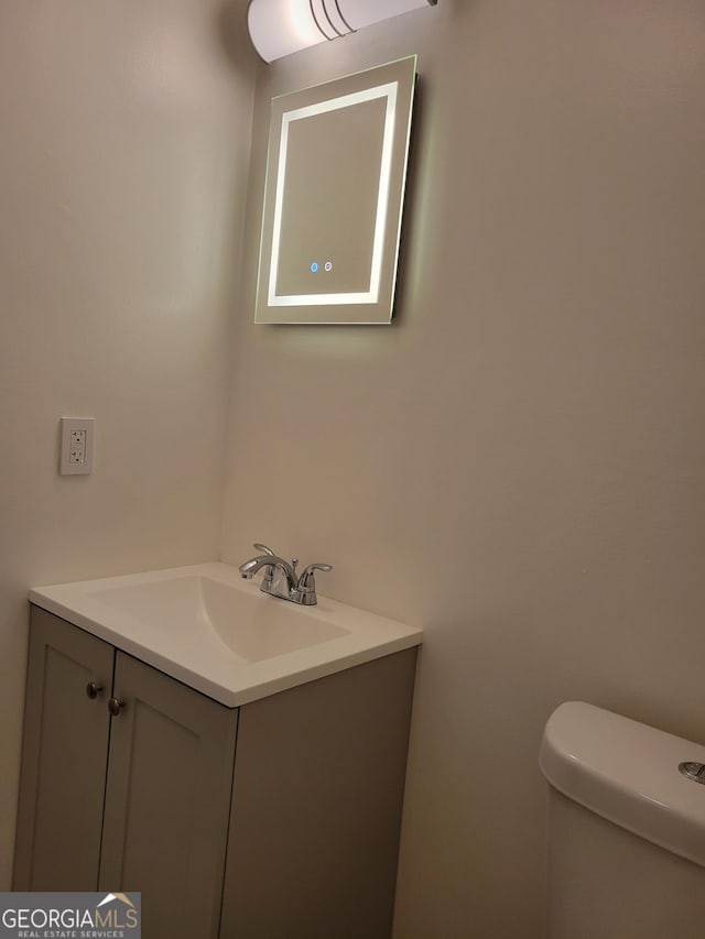 bathroom with vanity and toilet