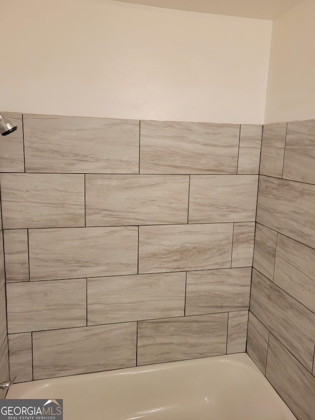 bathroom featuring  shower combination