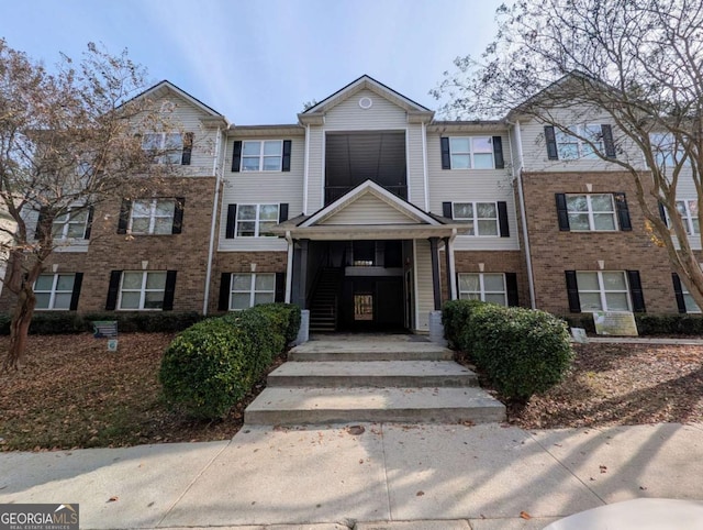 multi unit property featuring brick siding