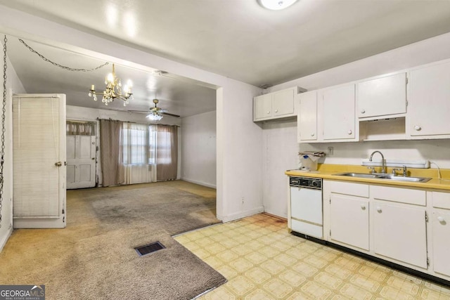 kitchen featuring visible vents, baseboards, white dishwasher, white cabinetry, and a sink