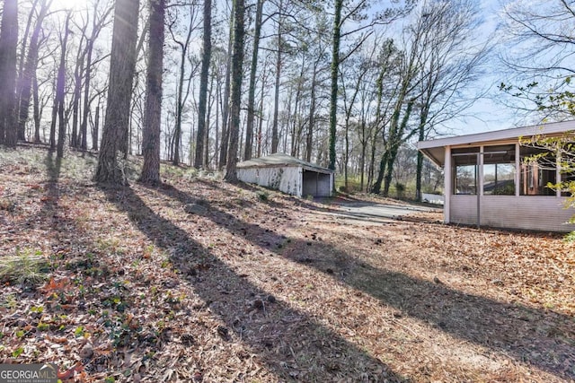 view of yard with a sunroom