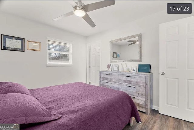 bedroom featuring dark wood-type flooring and ceiling fan