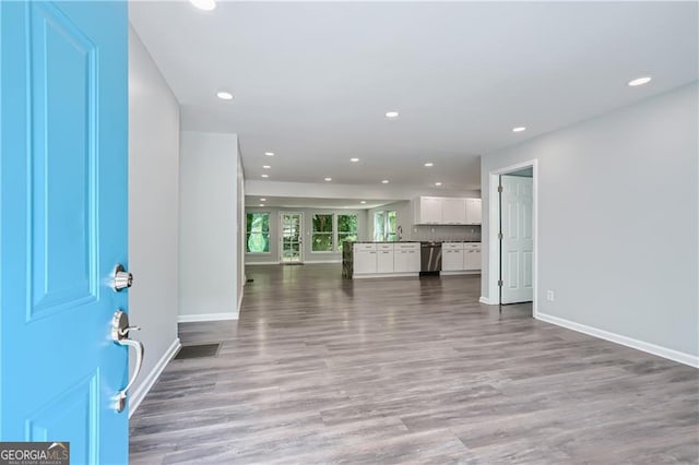 interior space with visible vents, recessed lighting, baseboards, and wood finished floors