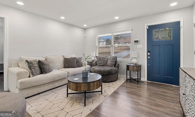 living area featuring recessed lighting, wood finished floors, and baseboards