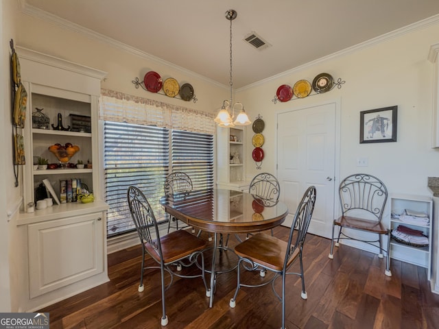 dining room featuring dark wood finished floors, built in shelves, visible vents, and ornamental molding