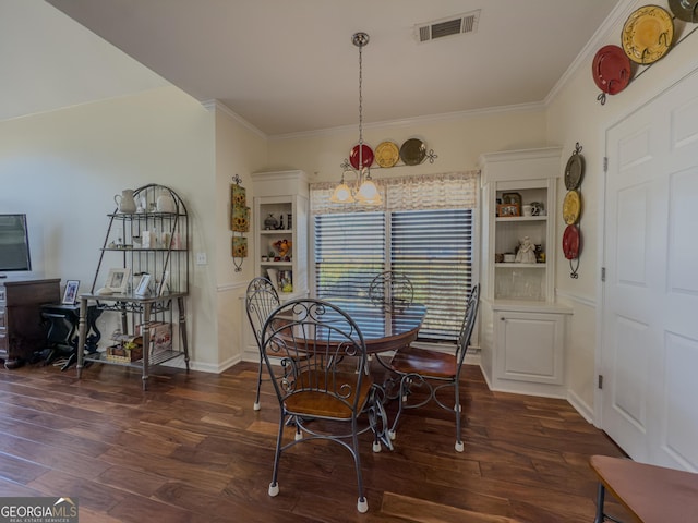 dining space with visible vents, an inviting chandelier, dark wood-style flooring, and crown molding