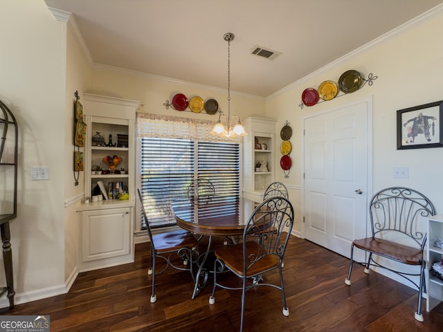 dining area with visible vents, a notable chandelier, ornamental molding, dark wood finished floors, and baseboards