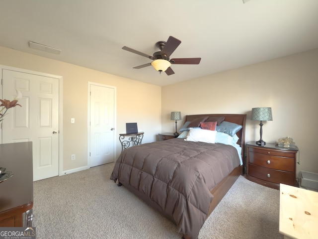 carpeted bedroom featuring baseboards and ceiling fan