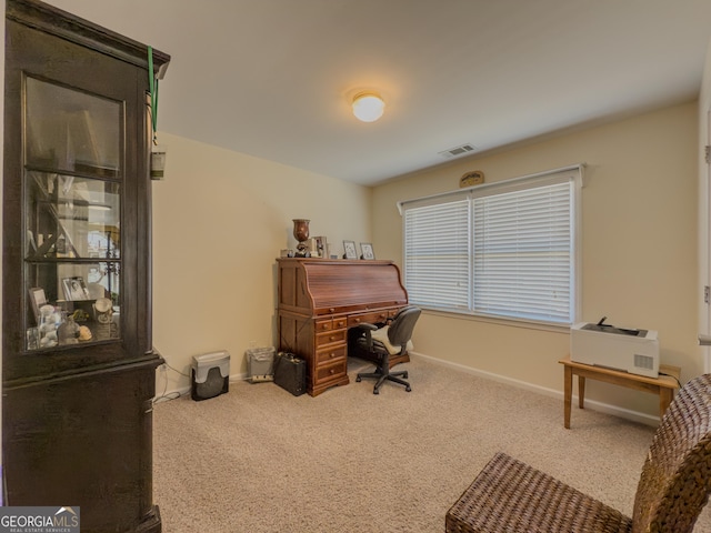 office with baseboards, visible vents, and carpet floors