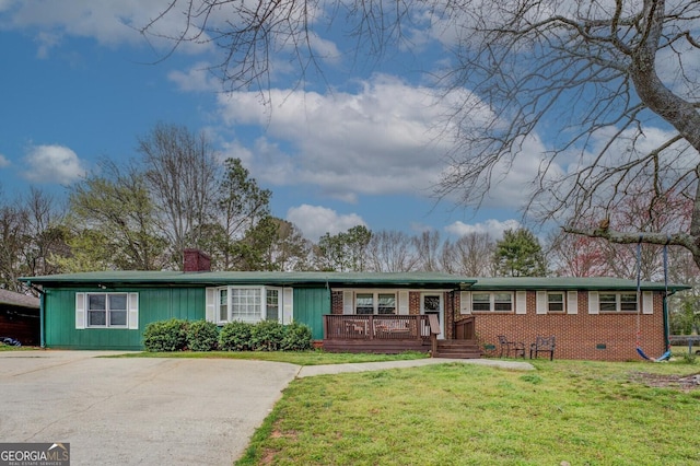 single story home with a front yard, a porch, a chimney, crawl space, and brick siding