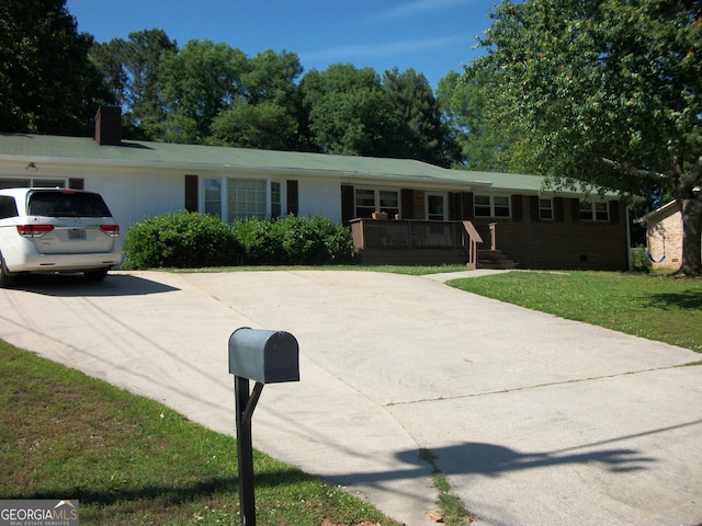 10174 Twin Oaks Dr SW, Covington, GA 30014 - single story home with a front lawn, concrete driveway, and a chimney