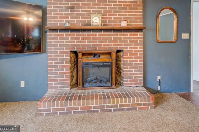 10174 Twin Oaks Dr SW, Covington, GA 30014 - details featuring a brick fireplace and carpet flooring