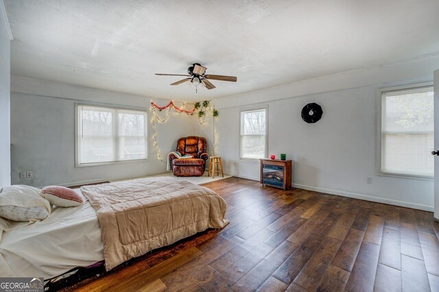 10174 Twin Oaks Dr SW, Covington, GA 30014 - bedroom with wood-type flooring, a ceiling fan, and baseboards