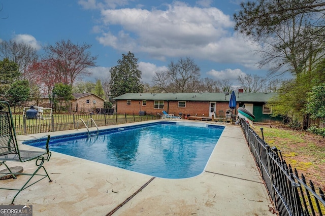 view of pool with a patio area, fence, and a fenced in pool