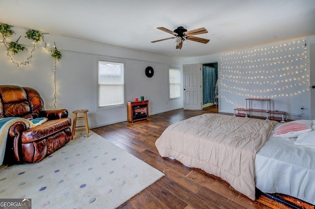 10174 Twin Oaks Dr SW, Covington, GA 30014 - bedroom featuring a ceiling fan, wood finished floors, and baseboards