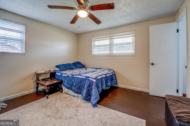 10174 Twin Oaks Dr SW, Covington, GA 30014 - bedroom with wood finished floors, baseboards, and a ceiling fan