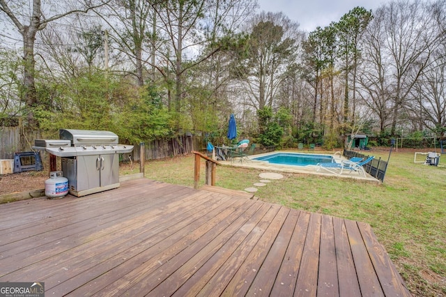 10174 Twin Oaks Dr SW, Covington, GA 30014 - wooden terrace featuring a grill and view of wooded area