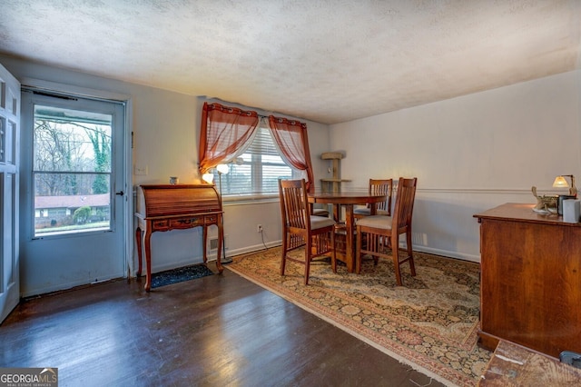 10174 Twin Oaks Dr SW, Covington, GA 30014 - dining area with a textured ceiling, a wealth of natural light, baseboards, and wood finished floors