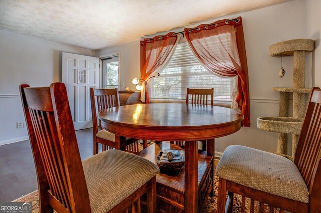 10174 Twin Oaks Dr SW, Covington, GA 30014 - dining room featuring baseboards and a textured ceiling