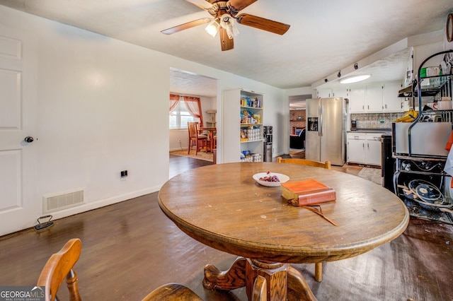10174 Twin Oaks Dr SW, Covington, GA 30014 - dining room with ceiling fan, baseboards, visible vents, and wood finished floors