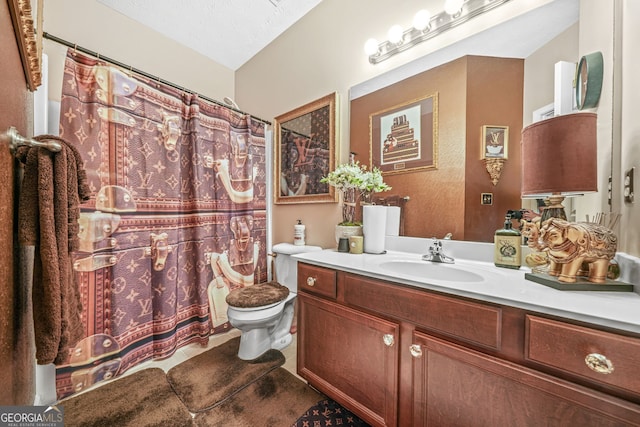 full bath with curtained shower, toilet, vanity, and tile patterned flooring